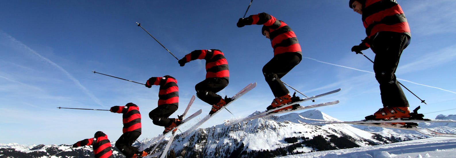 A skier jumping at Private Ski Lessons for Adults of All Levels.