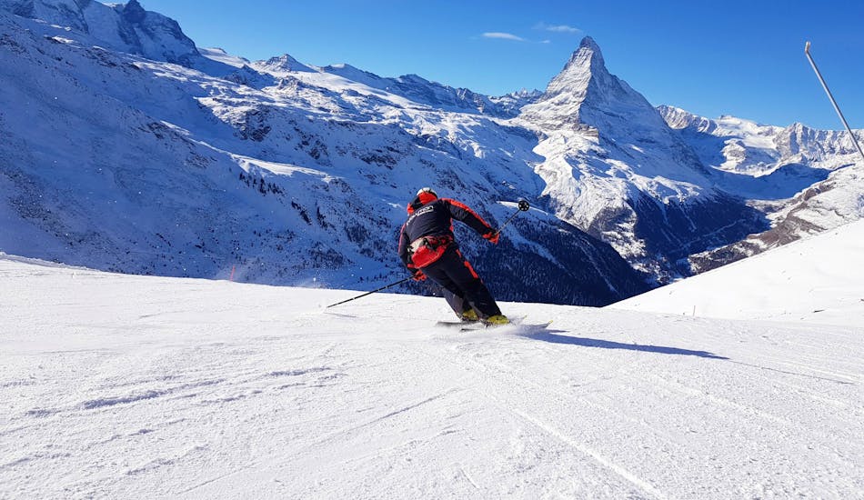 An adult enjoying Zermatt's slopes at the Private Ski Lessons for Adults of All Levels.