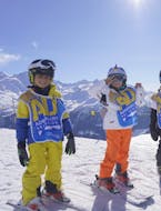 Two children learn to ski during a kids ski lessons 6 Max with Adrenaline Verbier.