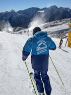 Two skiers stand in the snow, let the sun shine on them and smile into the camera during Private Ski Lessons for Adults - All Levels with the ski school Skischule Thomas Spenzel.