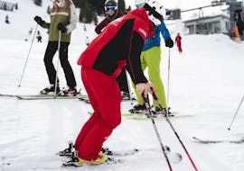 A ski instructor teaching a group of adults at Adult Ski Lessons for Advanced Skiers from Skischule Obergurgl.