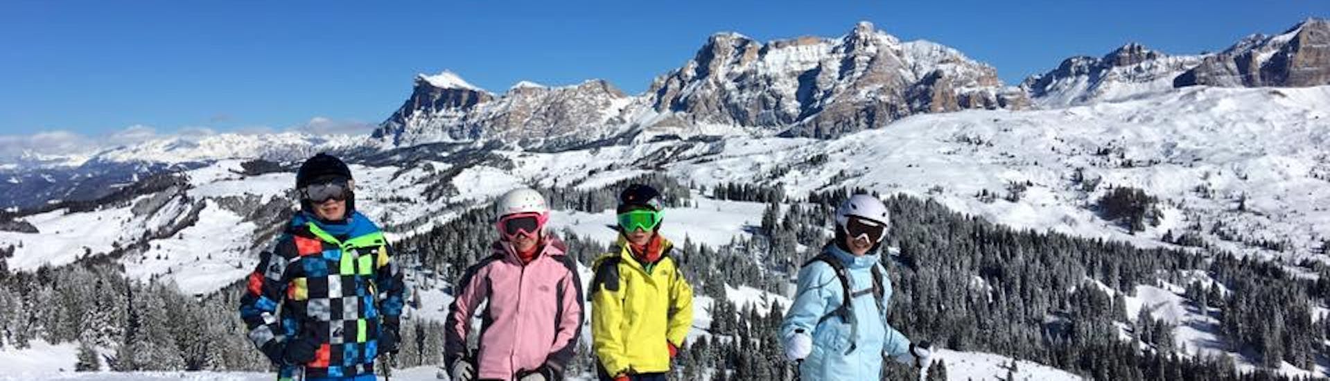 Kids taking a group picture in Selva di Val Gardena (Wolkenstein) during one of the Kids Ski Lessons (4-12 y.) for All Levels - Full Day