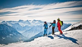 Three people enjoy the view during their Private Ski Lessons for Adults of All Levels from Snow & Mountain Sports Loitzl Loser.