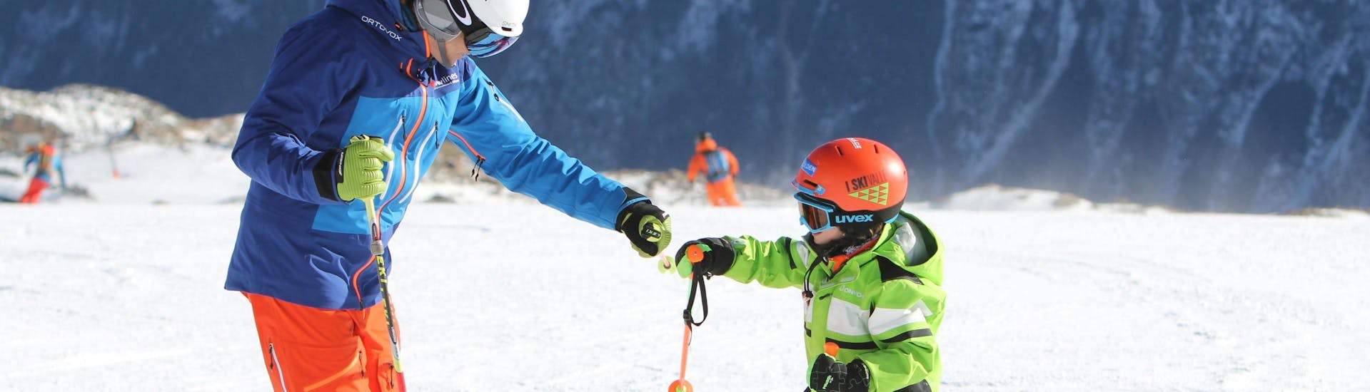 A young skier is having fun with a private ski instructor from the ski school during a Private Ski Lessons for Kids in Obergurgl-Hochgurgl organized by the ski school Ski- und Snowboardschule SNOWLINES Sölden in the ski resort of Sölden.