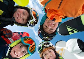 Children are participating at kids ski lessons for beginners with ski school Ruhpolding at the Westernberg ski area.