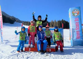 Kids and Instructor at the prize award ater the Kids Ski Lessons (from 4 y.) for All Levels with Ski School Dobbiaco