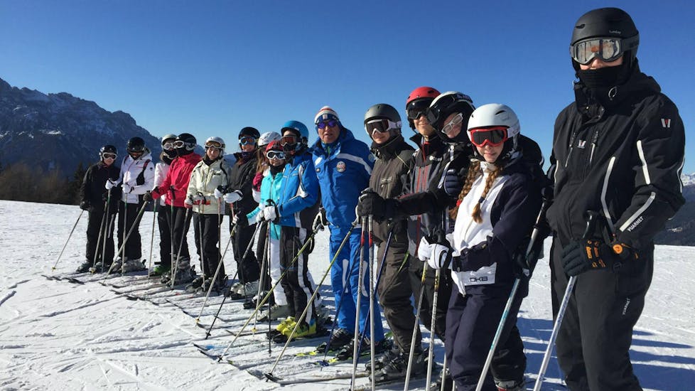 Group of adults learning how to ski in Dobbiaco.