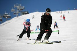 A child takes private ski lessons for kids of all levels at the Ski School Zell am See Outdo .