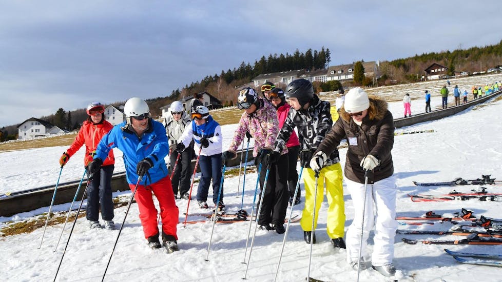 A ski instructor from WIWA | DSV Skischule & Skiverleih is teaching adults the basics of skiing during the Ski Lessons for Teens & Adults - All Levels.