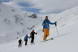 Four skiers during their private off-piste skiing lessons for advanced adults with ski school Warth.
