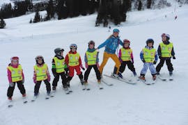 A row of kids during their kids ski lessons for advanced skiers with skischool Warth in Warth-Schröcken.