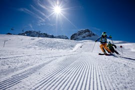A skier riding down the slopes during his private ski lessons for adults of all levels with skischool Warth-Schröcken.