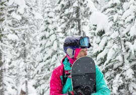 Photo d'une jeune femme apprenant à faire du snowboard lors de cours particuliers de snowboard pour les familles - tous niveaux avec l'école de ski Schneesportschule Morgenstern.