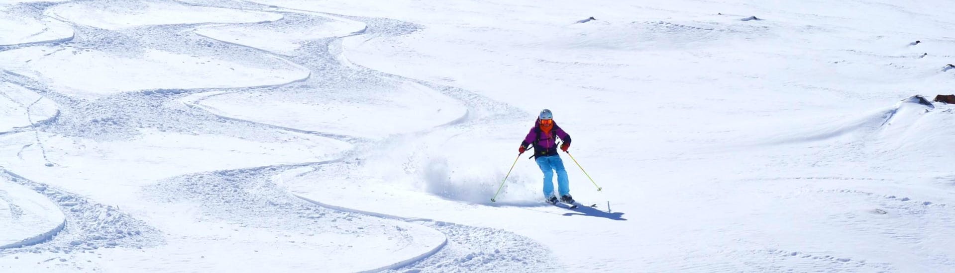 A skier crosses a powder field during teen and adults ski lessons with the ESI Pro Skiing Châtel. 