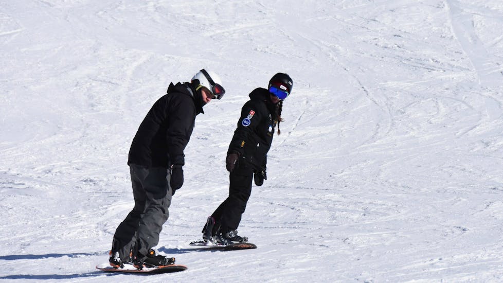 Snowboarder learning new skills during a Private Snowboarding Lessons for Kids & Adults of All Levels with Ski Cool St. Moritz.