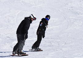 Snowboarder learning new skills during a Private Snowboarding Lessons for Kids & Adults of All Levels with Ski Cool St. Moritz.