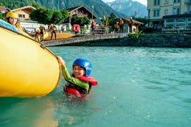 A kid enjoying the Family Rafting on the Lütschine River in Interlaken with Outdoor Switzerland AG