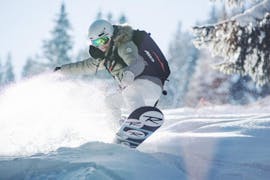 A private snowboarding lesson takes place on the slopes of Courchevel with ESI First Tracks.