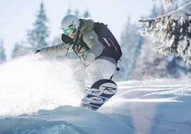 A private snowboarding lesson takes place on the slopes of Courchevel with ESI First Tracks. 