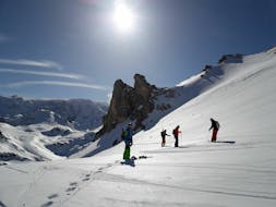 A group of skiers with a private ski touring guide of ESI First Tracks Courchevel.