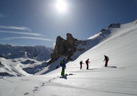 A group of skiers with a private ski touring guide of ESI First Tracks Courchevel.