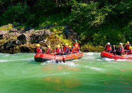 Parents with their children riding on the Tiroler Großache on their "Rafting Experience" Tour with the experienced instructors from Adventure Club Kaiserwinkl.