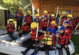 A family is having fun during the Rafting on Durance River for Families activity with Ecrins Eaux Vives.