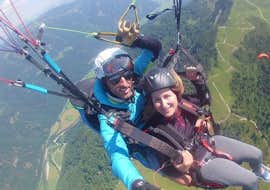 Tandem Paragliding from Unterberghorn - Long-Distance Flight Airtaxi Kössen Cover A woman and instructor during Tandem Paragliding from Unterberghorn - Long-Distance Flight Airtaxi Kössen.