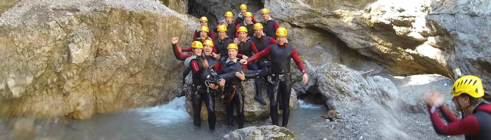 Group picture after an adventurous day while Canyoning in Taxaklamm at Kirchdorf with Mountain High Adventure Center Tirol.