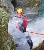 A man abseiling from a waterfall during the XL Canyoning in Zemmschlucht near Mayrhofen with Actionclub Zillertal.