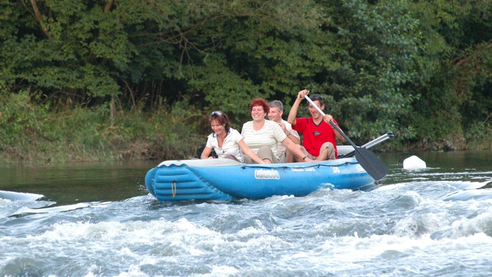 Four people in a raft during Rafting on the Neisse from Zentendorf to Rothenburg - Short with Neisse Tours Rothenburg