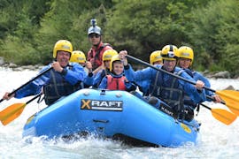 A family is having fun during the rafting activity Rafting for families on the river Noce organized by X Raft Val di Sole.