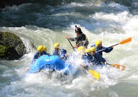 Rafting on the Noce River in Mezzana for Groups - Colorado Enjoy from X Raft Val di Sole Some participants of the Rafting Colorado Enjoy organized by X Raft Val di Sole on the river noce are having fun on the rafts.