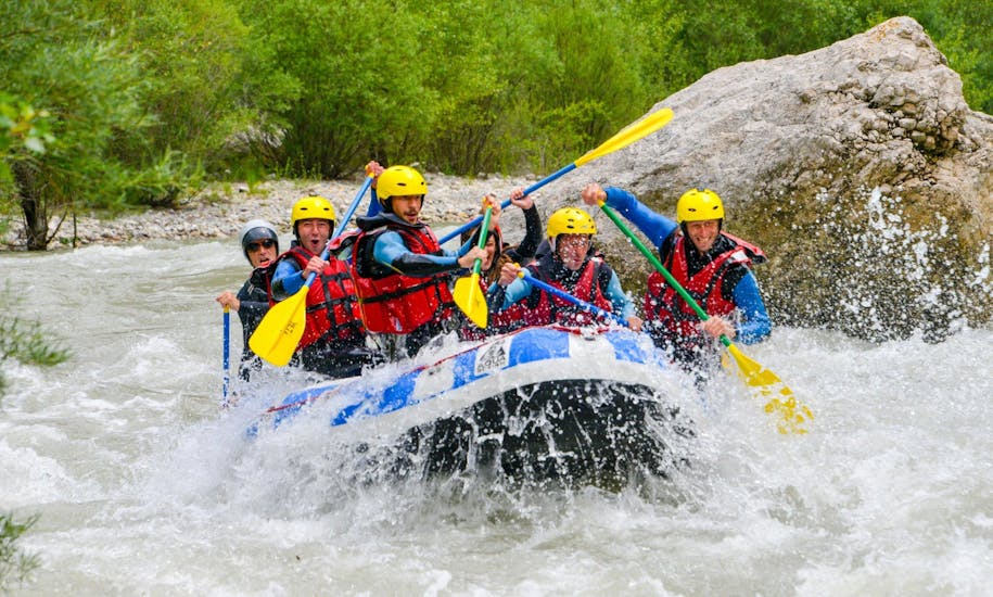 A group is caught in rapids and is having fun during the rafting descent of the full Verdon river organized by Yeti Rafting.