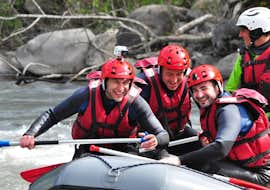 Classic Rafting on the Ubaye River in Le Lauzet-Ubaye with Anaconda Rafting Ubaye Three friends are spending a good time paddling during their Classic Rafting on the Ubaye River with Anaconda Rafting.