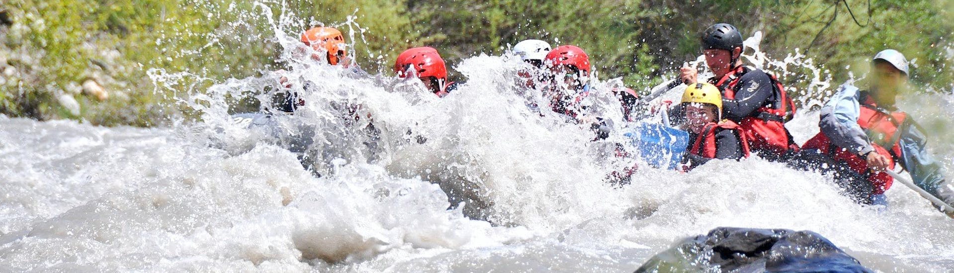 Participants in the Adventurous Rafting Combo on the Ubaye River with Anaconda Rafting are caught in heavy rapids.