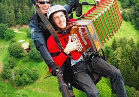 Playing some music during the Paragliding at Punta Cervina - Mountain Station Flight with FlyHirzer Saltusio.