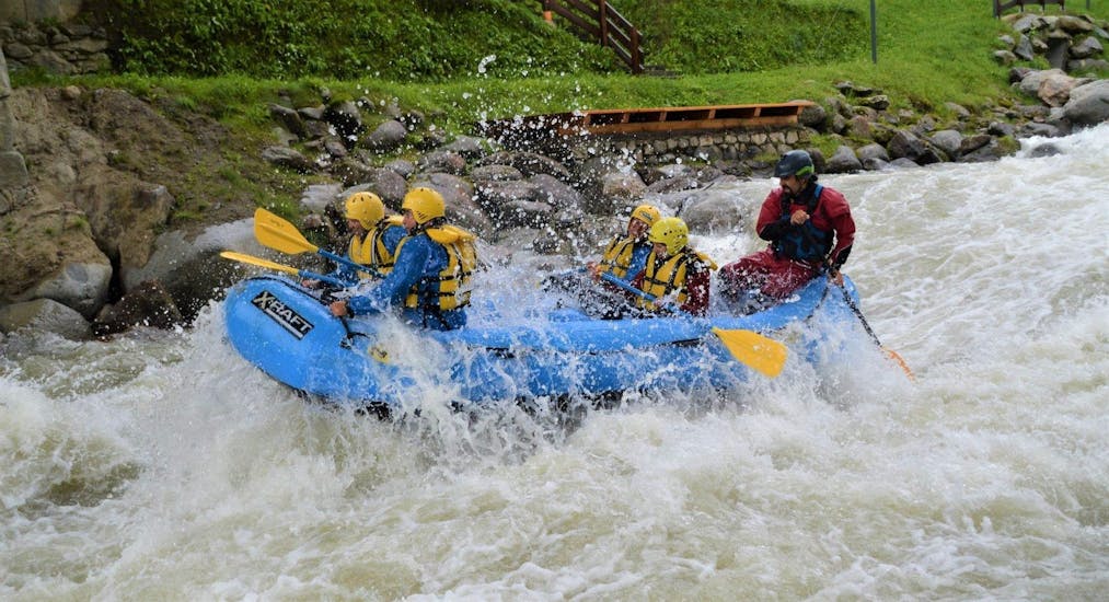 The participants of the Rafting Colorado Slalom on the river Noce are conquering the rapids while having fun during the activity organized by X Raft val di Sole.
