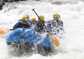 Some participants are conquering the rapids of the river Noce during the activity Rafting Colorado Slalom organized by X Raft Val di Sole.