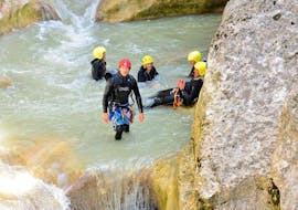 Friends are taking a break in a natural pool while doing Canyoning in the Upper Jabron Canyon - Classic with Raft Session Verdon.