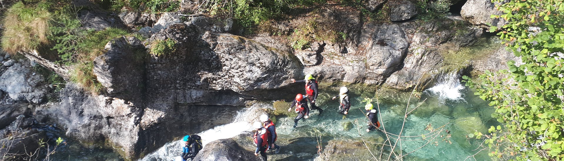 Group of participants are walking in the canyon during the Canyoning in the Palvico in Pieve di Ledro with Trentino Climb.