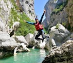 A man jumps into the water during the Half Day River Trekking from Castellane in Couloir Samson.