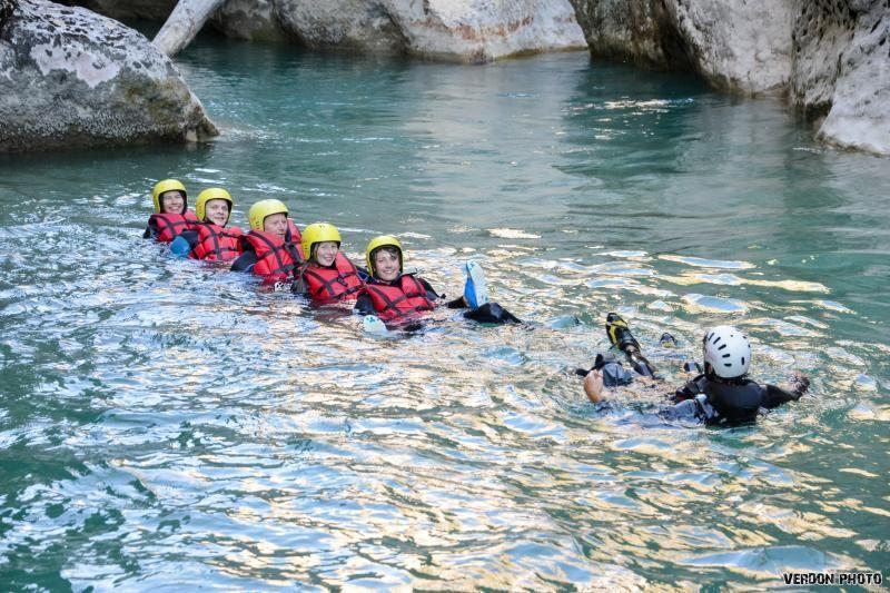 Photo of a group in the water during the River Trekking in Chaos de l'Imbut from Castellane with Raft Session Verdon.