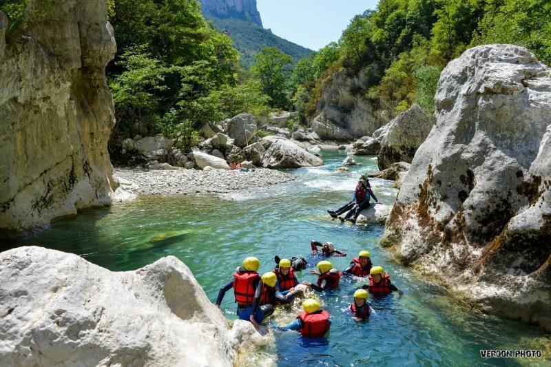 Photo of a group in the water during the River Trekking in Chaos de l'Imbut from Castellane with Raft Session Verdon.