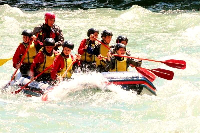 Rafting on the Adda River near Sondrio - Full Fun Tour  from Rafting Lombardia A raft with a team of 8 people is going down the Adda during the Rafting on the Adda - Full Fun of Rafting Lombardia.