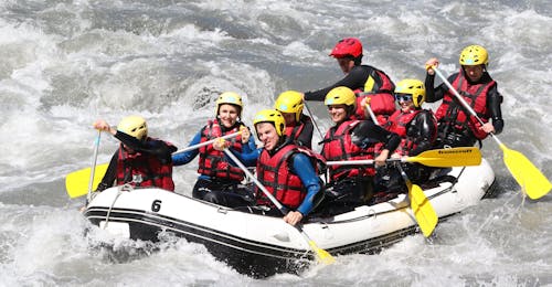 Rafting on the Isère River in Landry - Full Descent with Evolution 2 Peisey Vallandry - H2o Sport People are paddling within a rapid during the Rafting on the Isère River in Landry - Full Descent with Evolution 2 Peisey Vallandry - H2o Sport.