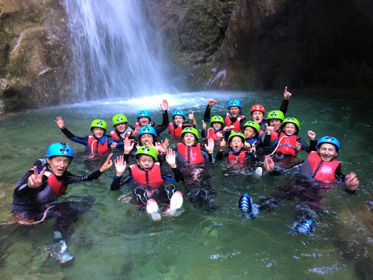 A group of friends is having fun during the Canyoning in Rio Nero at Lake Garda for Families & Beginners with LOL Garda.