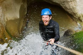A man is going down a abseiling section during his Canyoning in Canyon du Llech - Sensation activity with Extérieur Nature.