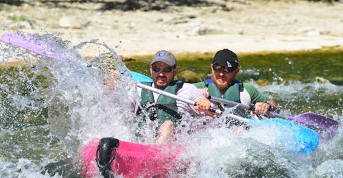 32km Kayak & Canoe Hire in Ardèche - Intense Ardèche Two friends are descending the river section "Intense Ardèche - 32km" in Ardèche on a high-quality canoe rented at Aigue Vive.
