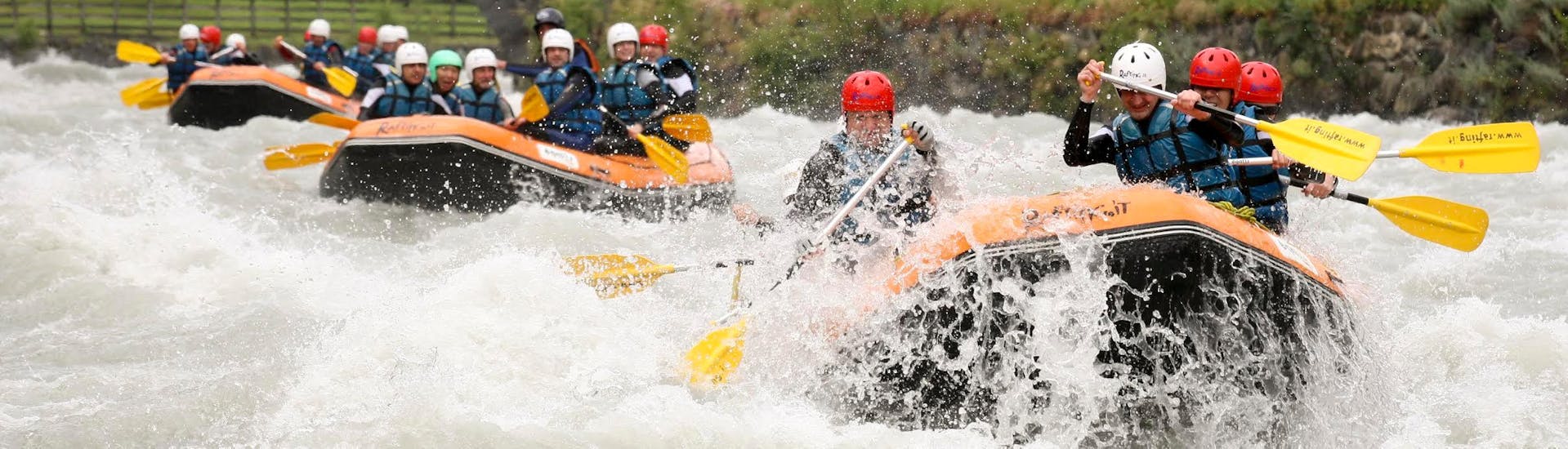 The waves are crushing on the raft during this adrenaline-filled activity of the Adventurous Rafting on the Dora Baltea with RaftingIT Valle d'Aosta.